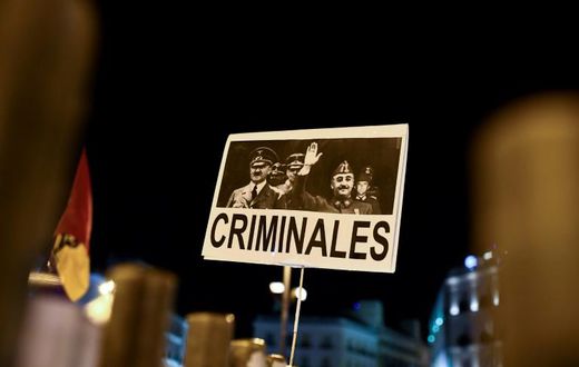A placard depicting German leader of the Nazi party Adolf Hitler and Spanish dictator Francisco brandished in Madrid last year during a protest after Franco's remains were moved from a grandiose state mausoleum to  more discreet grave