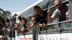 Palestinian prisoners cross into the Gaza Strip following their release from Israeli jails in the last exchange between the two sides in October 2011