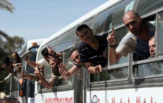 Palestinian prisoners cross into the Gaza Strip following their release from Israeli jails in the last exchange between the two sides in October 2011