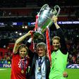 Current Bayern Munich captain Manuel Neuer (R) lifts the Champions League trophy alongside former coach Jupp Heynckes (C) after the 2013 final in London.