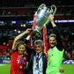Current Bayern Munich captain Manuel Neuer (R) lifts the Champions League trophy alongside former coach Jupp Heynckes (C) after the 2013 final in London.
