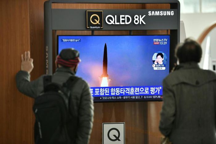 People watch footage of a North Korean missile test at a railway station in Seoul