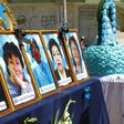 A woman looks at photos of health workers in Puno, Peru who died from Covid-19