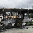 Protesters torched a bus in a working-class district of Abidjan