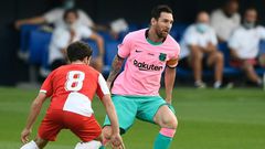 In the pink: Messi evaded Girona defenders to set up Barcelona's first goal and to score the second and third