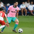 In the pink: Messi evaded Girona defenders to set up Barcelona's first goal and to score the second and third