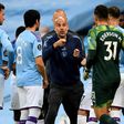 Pep Guardiola (centre) says he has to earn a new contract at Manchester City this season