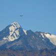 An Indian fighter flies over mountains near the border with China, where military tensions have escalated since clashes in June