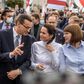 Exiled opposition leader Svetlana Tikhanovskaya walks with Polish Prime Minister Mateusz Morawiecki after telling Warsaw university students events in Belarus were 'historic'