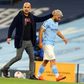 Manchester City striker Sergio Aguero (R) and his manager Pep Guardiola