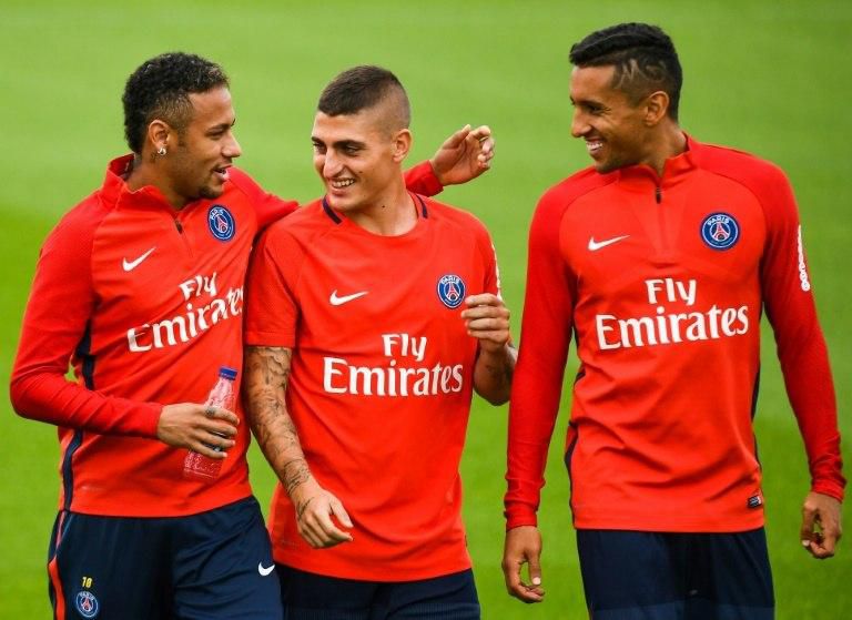 (From L) Paris Saint-Germain's Neymar, Marco Verratti and Marquinhos talk during a training session at the club's training centre in Saint-Germain-en-Laye near Paris, on September 6, 2017