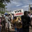 A man holding a sign reading "long live the army" at a rally in Mali's capital Bamako in support of the junta