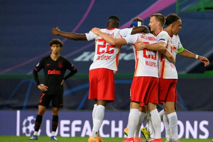 Captain Yussuf Poulsen (R) leads the celebrations after RB Leipzig beat Atletico Madrid 2-1 on Thursday to reach the semi-finals of the Champions League.