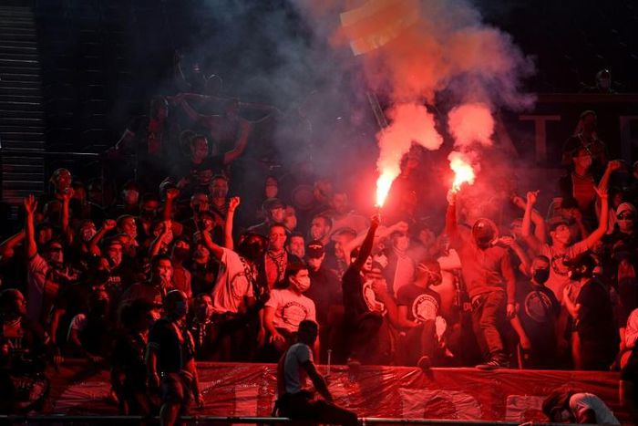 Paris Saint-Germain fans back their team while watching the Champions League final at the Parc des Princes