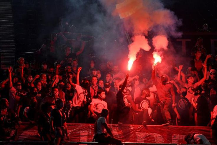 Paris Saint-Germain fans back their team while watching the Champions League final at the Parc des Princes