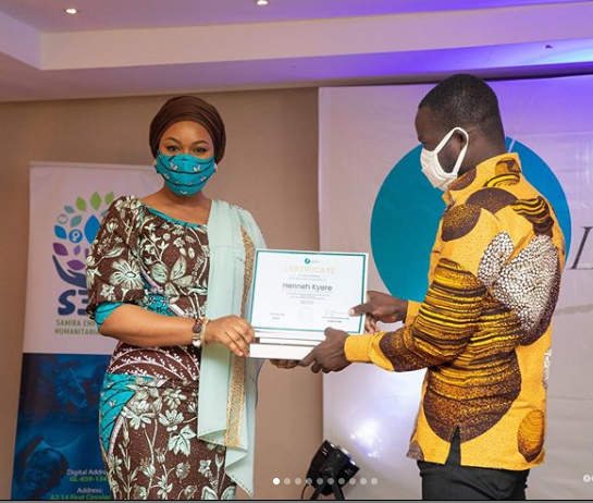 Samira Bawumia awarding certificate to a writer