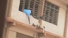 WASSCE 2020: Man captured sneaking “Apor” to students on storey building