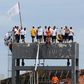 Inmates are seen on the top of a tower of the Puraquequara prison during a rebellion to demand better conditions as the coronavirus rages inside, in Manaus, Amazona State, Brazil, on May 2, 2020