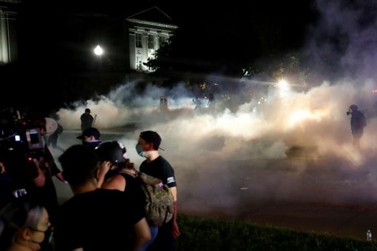 The violence occured as hundreds of protesters marched for a third night following the Jacob Blake