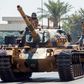 Turkish troops parade atop armoured vehicles in the northern part of Nicosia, the capital of the self-proclaimed Turkish Republic of Northern Cyprus on July 20, 2020, to mark the 46th anniversary of the Turkish invasion in 1974.