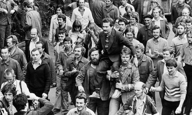 Lech Walesa was carried on fellow dockworkers' shoulders after signing a 1980 pact with Poland's Communist leadership