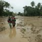 More than 14,000 people on the island of Sulawesi have been left homeless after flash floods engulfed thousands of houses in mud