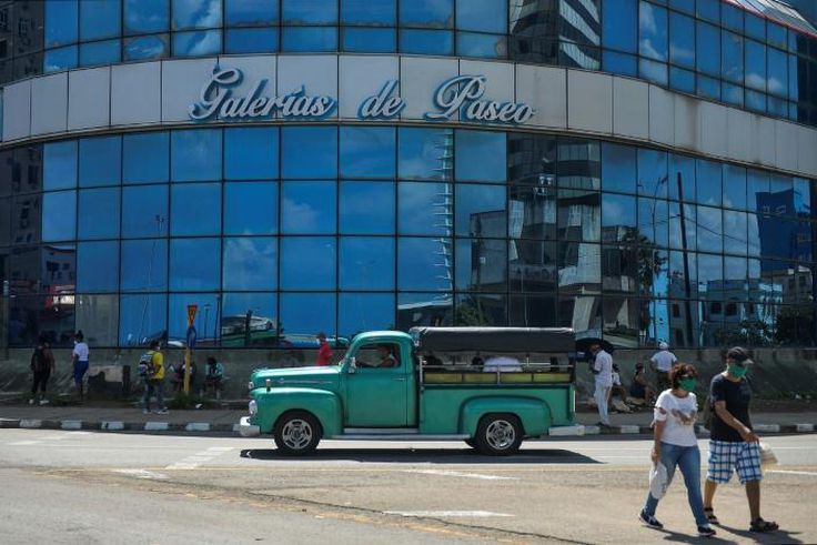 A group of people gather outside of a mall in Havana July 16, 2020 during the coronavirus pandemic