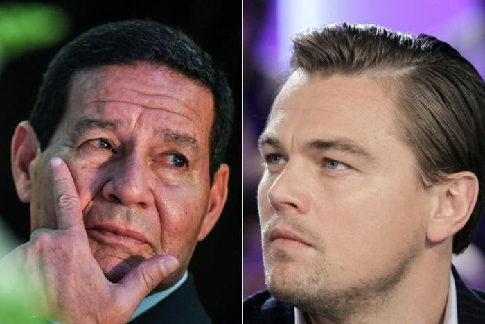 Brazilian Vice President Hamilton Mourao (L) has invited US actor Leonardo DiCaprio on an eight-hour hike in the Amazon after the film star posted a newspaper report on fires that are destroying large swathes of the rainforest
