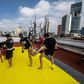 People take part in a Muay Thai martial art class on a roof in Mexico City, on August 15, 2020, as the country stuggles to get in shape amid the coronavirus pandemic