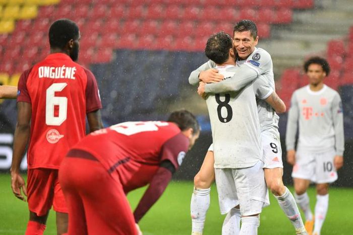 Robert Lewandowski (second from right) celebrates the second of his two Bayern Munich goals in Salzburg on Tuesday