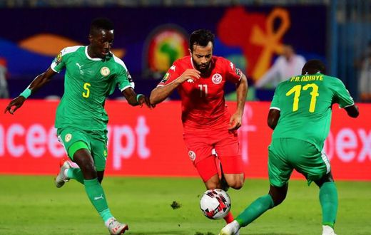 Tunisia star Taha Yassine Khenissi (C) playing against Senegal in a 2019 Africa Cup of Nations semi-final in Egypt