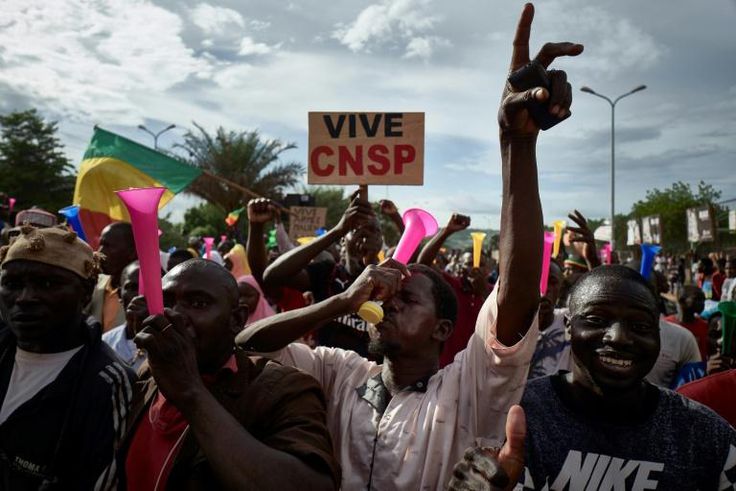 Supporters of the military junta, which calls itself the National Committee for the Salvation of the People, or CNSP, take part in a rally in Bamako this week