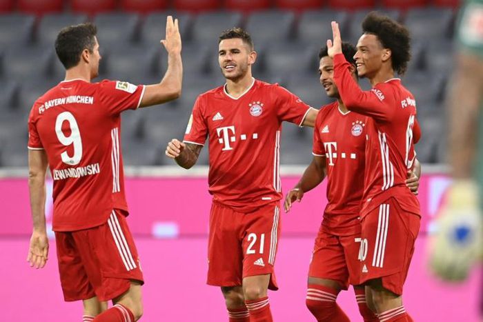 Bayern Munich players celebrate after scoring in their 8-0 rout of Schalke in their Bundesliga season opener
