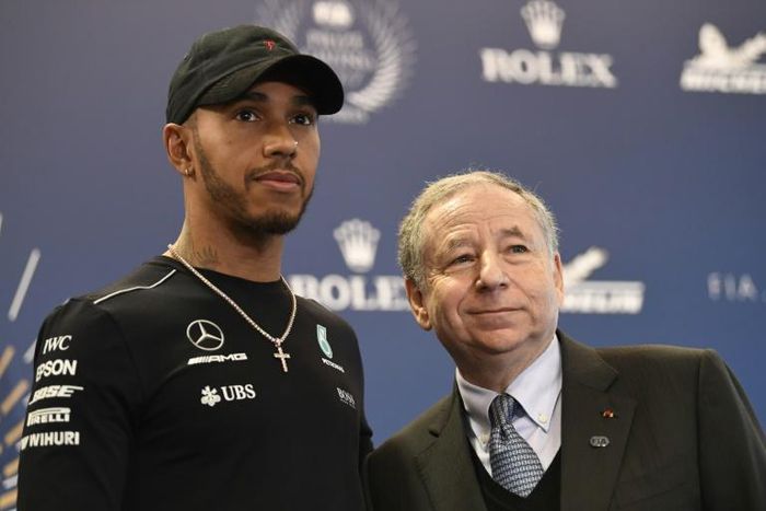Todt, pictured with Lewis Hamilton, said people must be free to opt out of taking part in anti-racism gestures