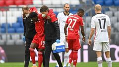 Alphonso Davies is helped off after tearing ankle ligaments on Saturday