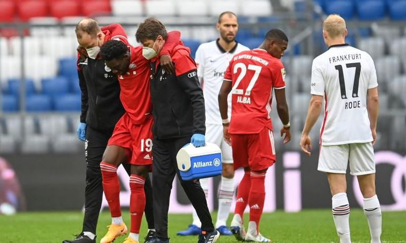 Alphonso Davies is helped off after tearing ankle ligaments on Saturday
