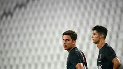 Paulo Dybala (L) and Cristiano Ronaldo (R) have been reported to prosecutors for breaking isolation.