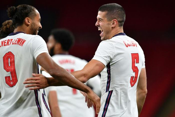 England's Conor Coady (R) celebrates with team-mate Dominic Calvert-Lewin (L)