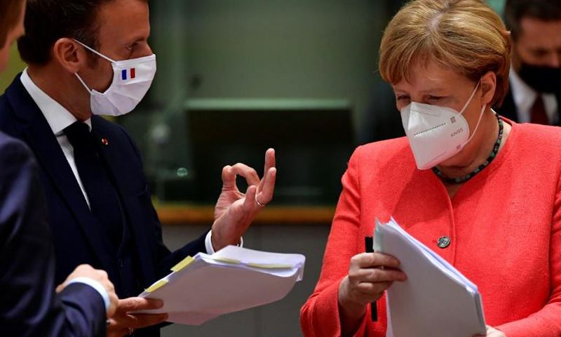 The EU leaders' summit began with smiles and COVID-proof elbow bumps, but soon got down to tense negotiations
