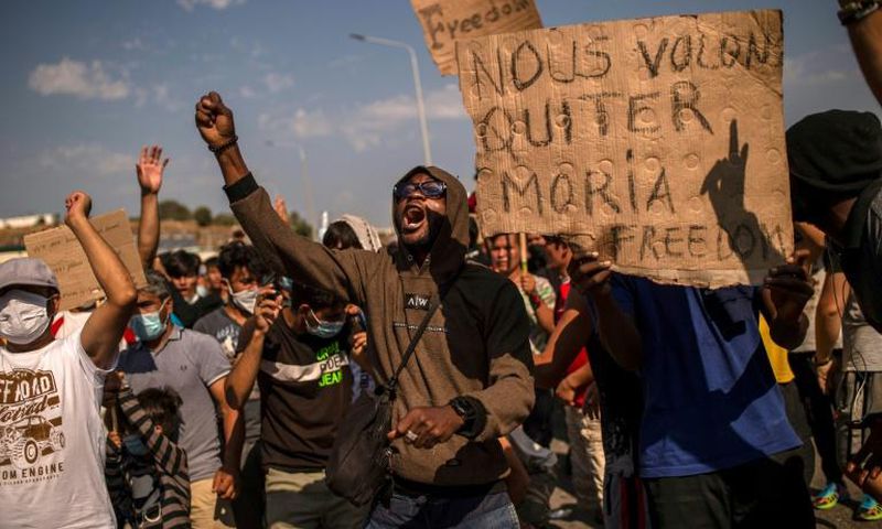 Protests by the migrants erupted on Lesbos on Saturday