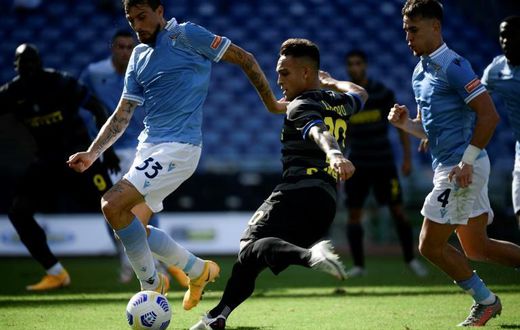 Inter Milan's Argentine forward Lautaro Martinez scores against Lazio