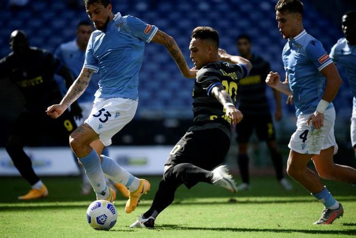Inter Milan's Argentine forward Lautaro Martinez scores against Lazio