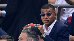 A dapper Kylian Mbappe watches Friday's French League Cup final from the stand -- the striker missed PSG's clash with Lyon because of an ankle injury