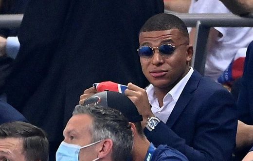 A dapper Kylian Mbappe watches Friday's French League Cup final from the stand -- the striker missed PSG's clash with Lyon because of an ankle injury