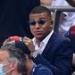 A dapper Kylian Mbappe watches Friday's French League Cup final from the stand -- the striker missed PSG's clash with Lyon because of an ankle injury