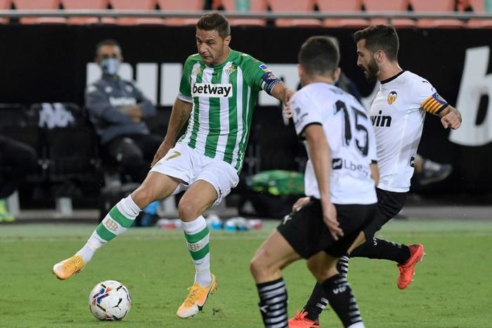 Real Betis provisionally moved atop La Liga with a 2-0 victory over Valencia on Saturday, Joaquin Sanchez (L) playing a crucial role in each goal