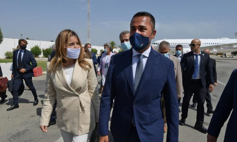 Italian Foreign Minister Luigi Di Maio (R) is welcomed on his arrival in Tunis by Tunisian Secretary of State for Foreign Affairs Salma Ennaiefer