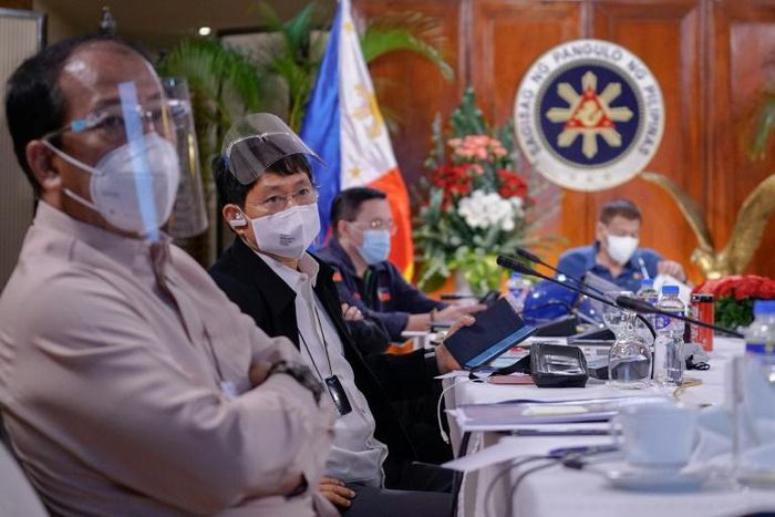 Philippines' Interior Secretary Eduardo Ano (second left) has tested positive for coronavirus five months after his initial illness