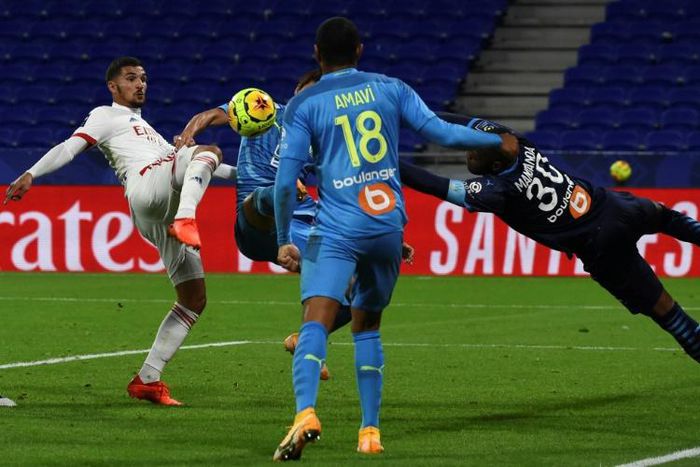 Houssem Aouar (L) has what he thought was his winning goal ruled out for a foul on Marseille keeper Steve Mandanda