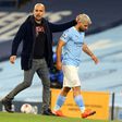 Manchester City striker Sergio Aguero (R) and his manager Pep Guardiola